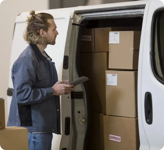 man writing down items