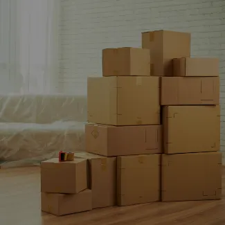 Mover wrapping a cardboard box